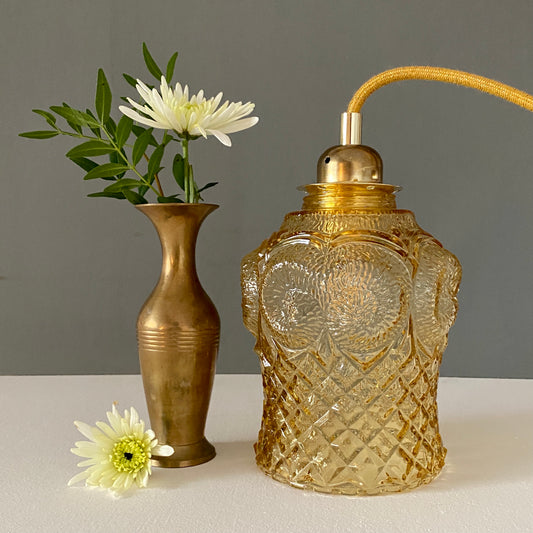 Baladeuse globe vintage en verre ambré