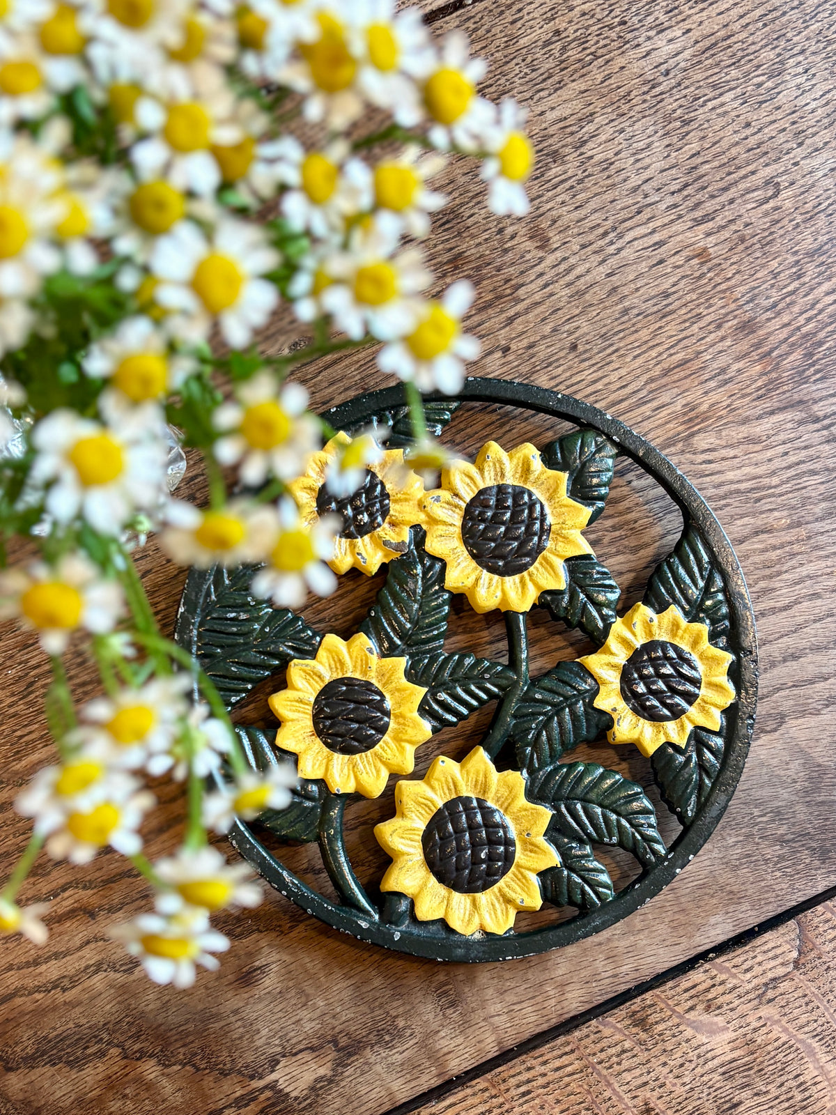 Dessous de plat vintage en fonte tournesol