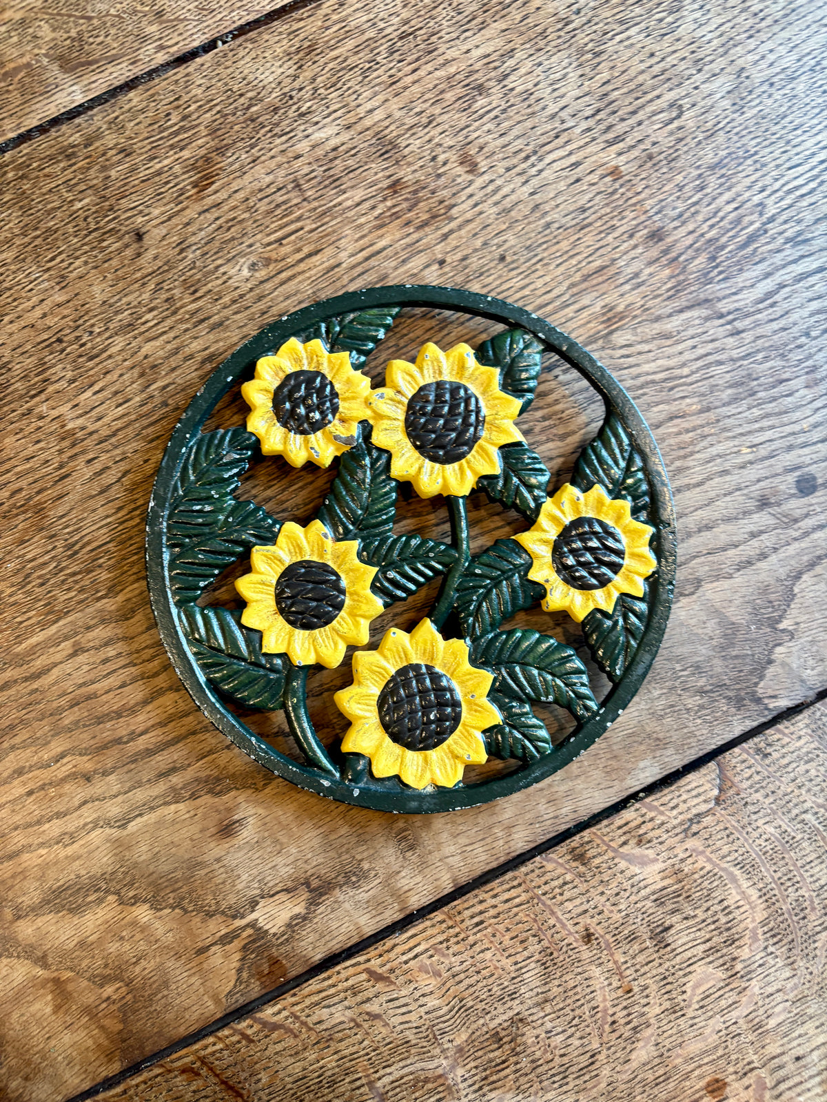 Dessous de plat vintage en fonte tournesol