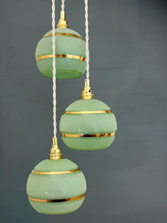Suspension triples globes vintage en verre granité vert et or